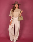 Pantalone palazzo con fiocco panna