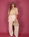 Pantalone palazzo con fiocco panna