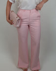Pantalone con spacchi sul fondo rosa