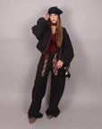 Pantalone balloon nero con cravatta