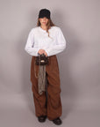 Pantalone palazzo brown con cintura a quadri