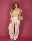 Pantalone palazzo con fiocco panna