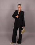 Tailleur con piume nero