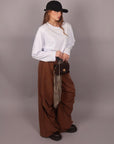 Pantalone palazzo brown con cintura a quadri