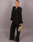Tailleur con piume nero